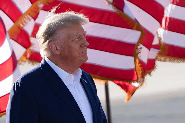 Donald Trump (this photo looks really bad, you can see the outline of his spray tan on his profile, it is very brown/orange compared to his skin color)