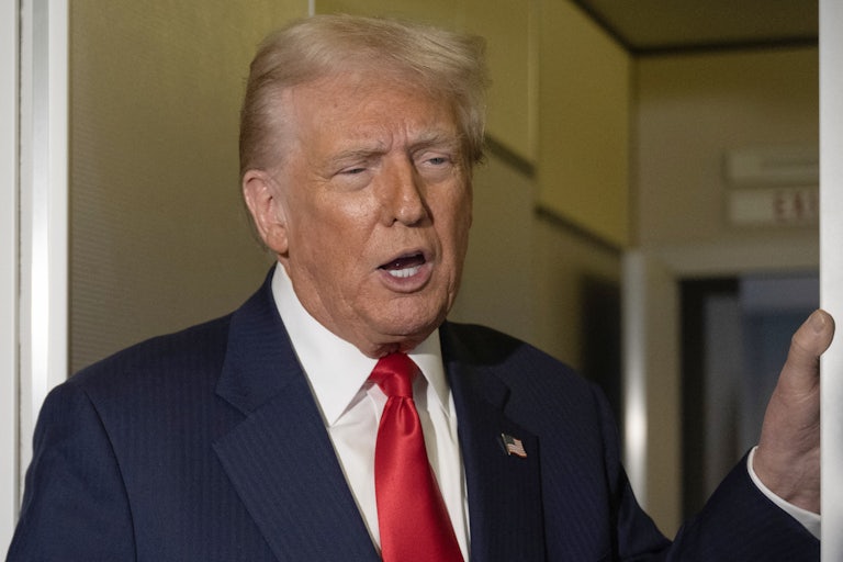 Donald Trump speaks to reporters on Air Force One