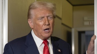 Donald Trump speaks to reporters on Air Force One