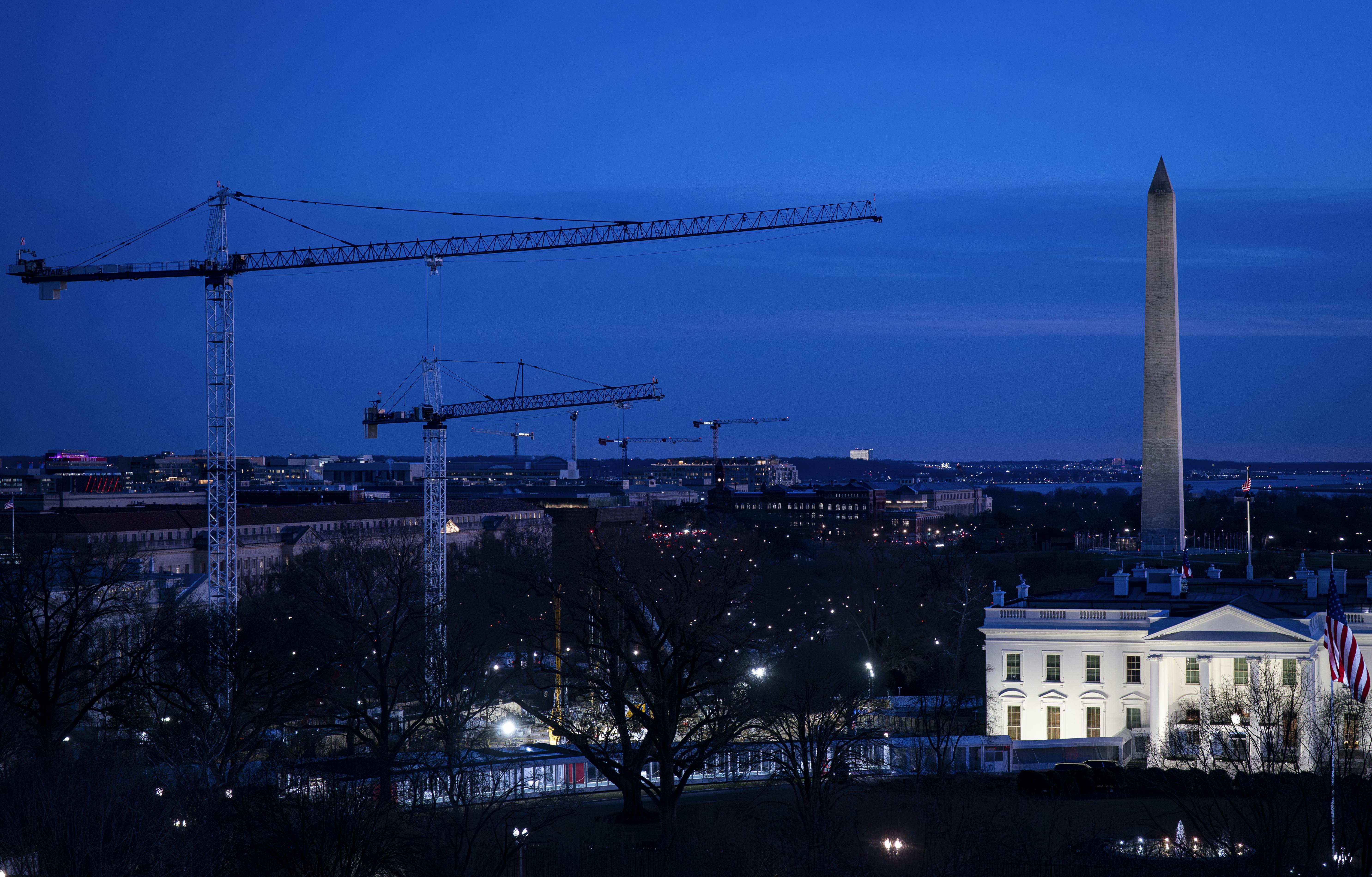 Construction cranes next to the White House