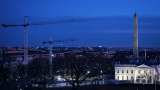 Construction cranes next to the White House