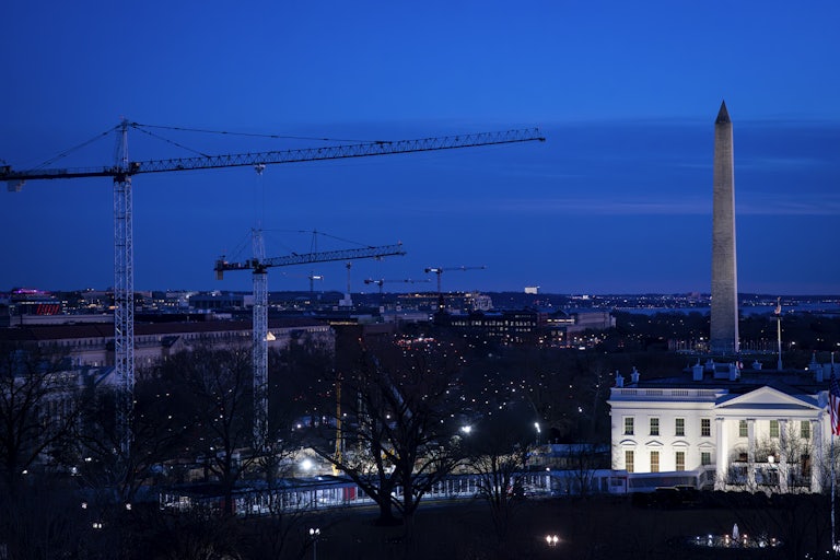 Construction cranes next to the White House