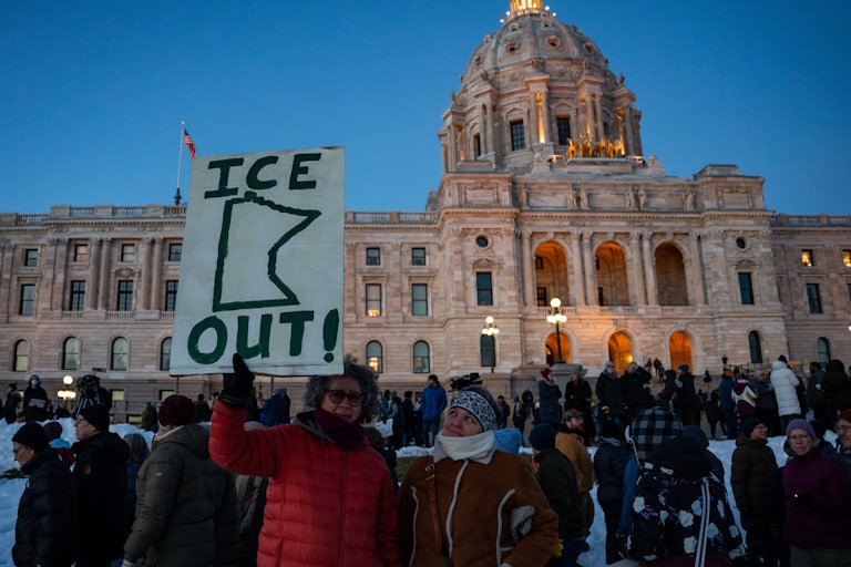 People protest against ICE outside the Minnesota state capitol in St. Paul