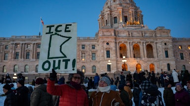 People protest against ICE outside the Minnesota state capitol in St. Paul