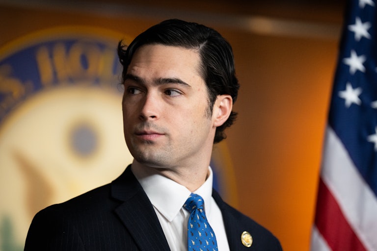 Representative Brandon Gill looks to the side during a press conference