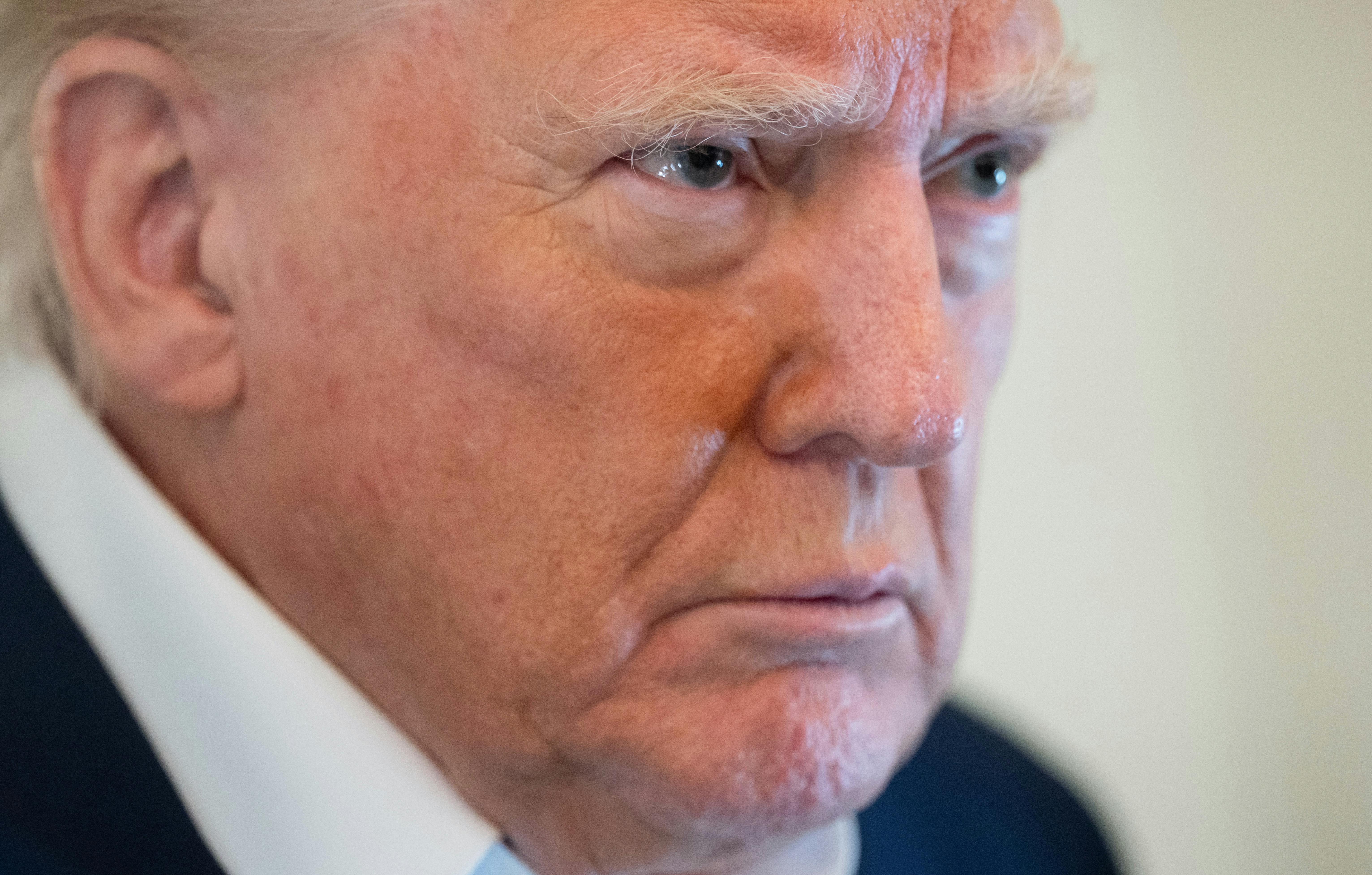 close up of Donald Trump looking constipated