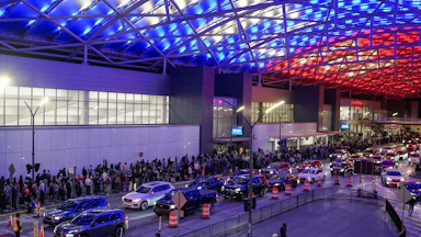 A long line of people outside of Hartsfield-Jackson Atlanta International Airport, waiting to get in.