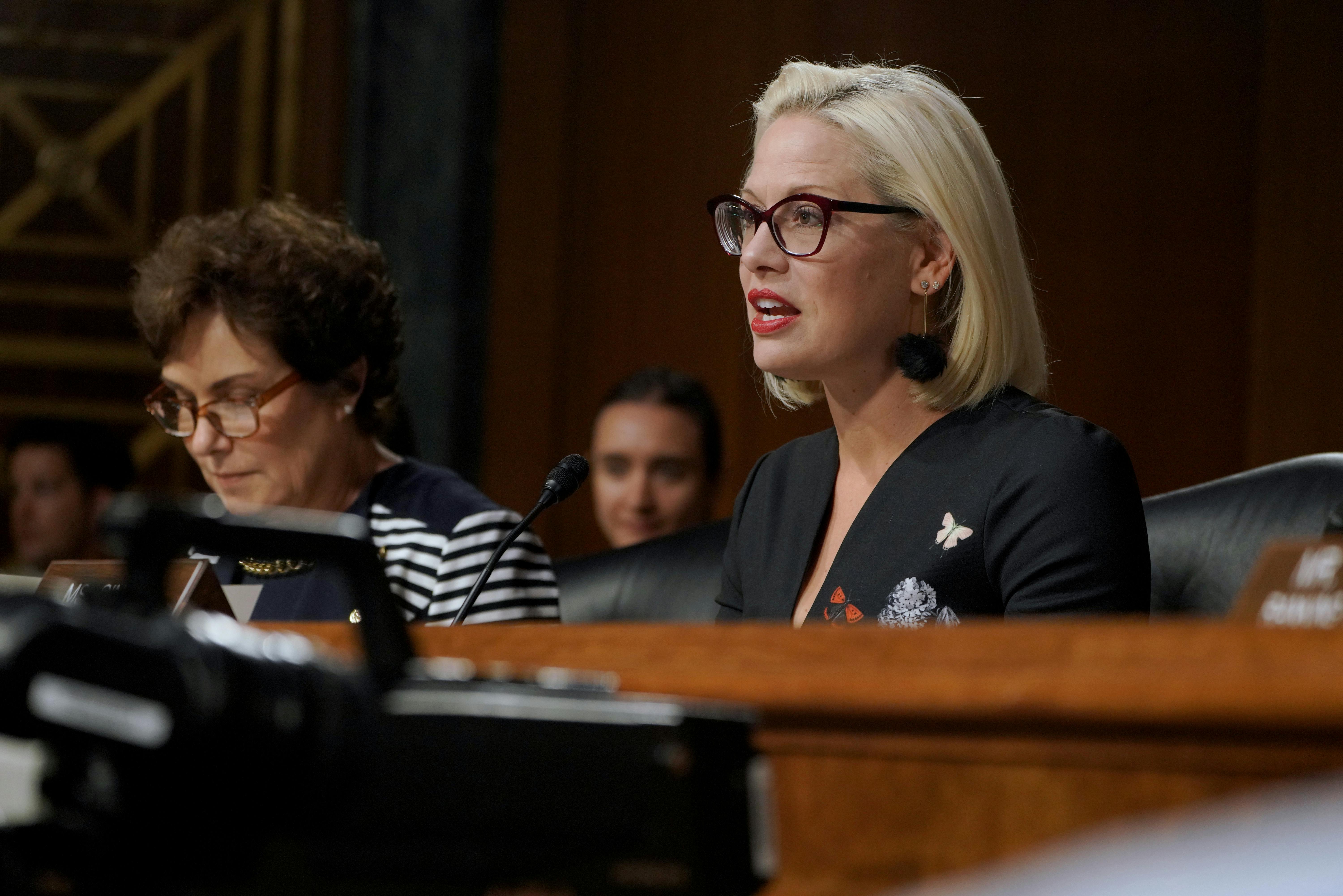 Senator Kyrsten Sinema speaks at the at a hearing on Capitol Hill.