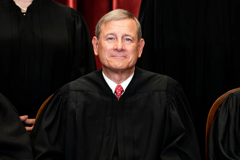 Chief Justice John Roberts smiles