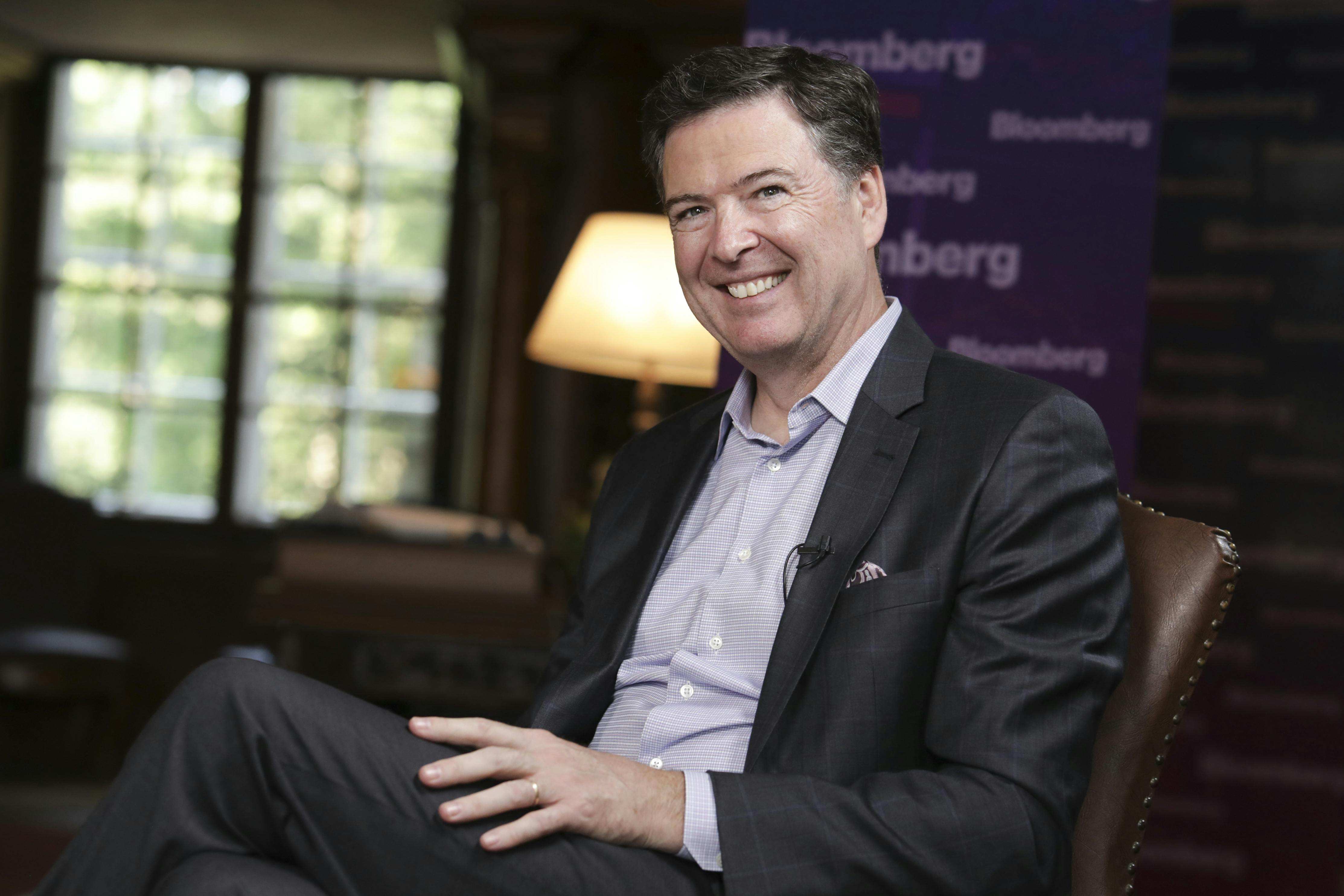 James Comey smiles