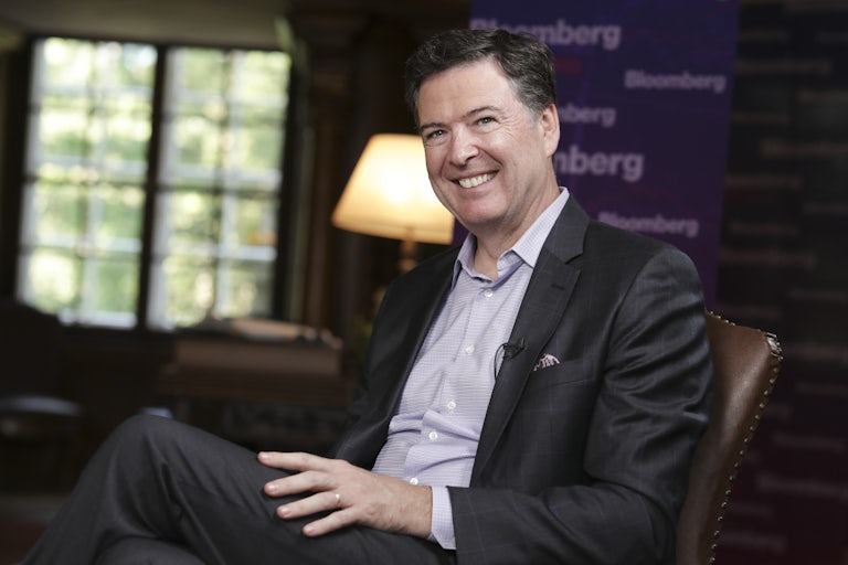 James Comey smiles