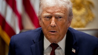 Donald Trump speaks while sitting in the White House Cabinet Room