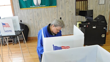 Bonnie Root of Victory votes in a mayoral election at the Victory Community Center on Tuesday, March 19, 2013 in Victory, N.Y.