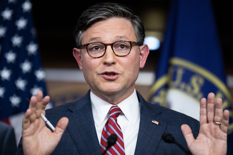 Mike Johnson gestures while speaking during a press conference after a House Republicans meeting