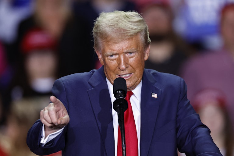 Donald Trump speaking at a mic