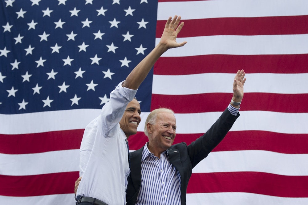 obama and biden in front of flag