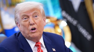 Close up of Donald Trump sitting in the Oval Office.