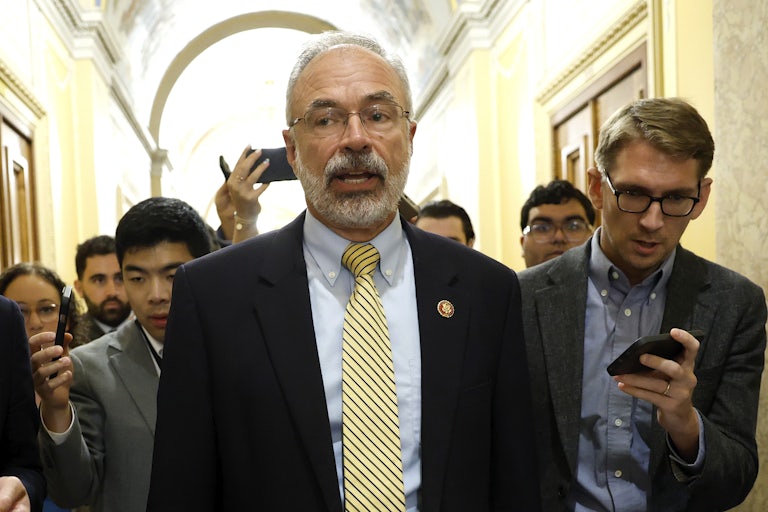 House Freedom Caucus Chair Andy Harris speaks to reporters while walking in the Capitol