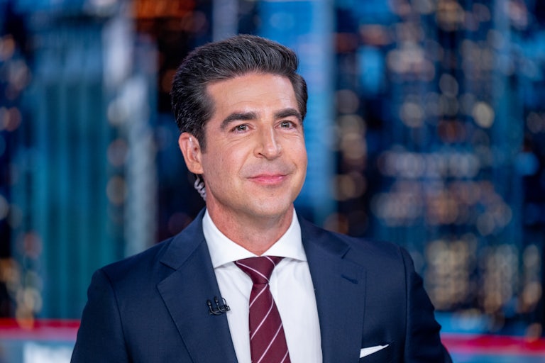 Jesse Watters sits on the set of his Fox News show