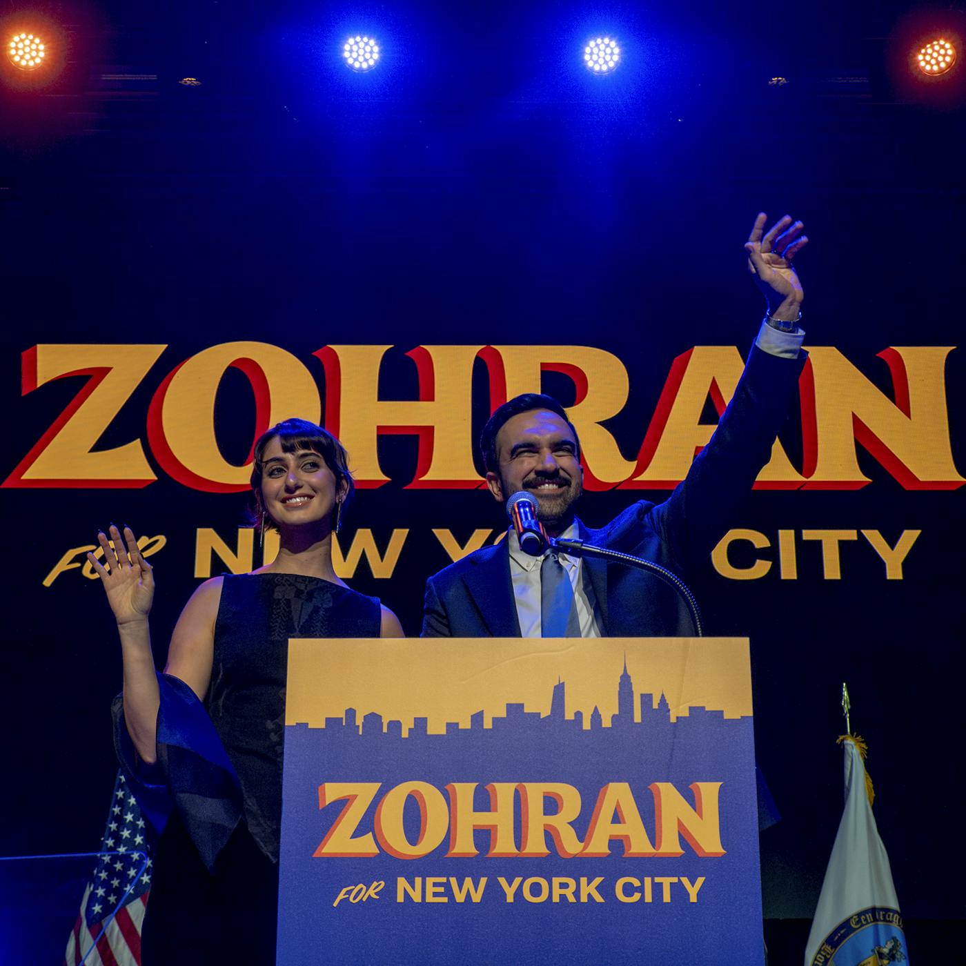 Mamdani onstage with his wife, Rama Sawaf Duwaji, after being declared the winner