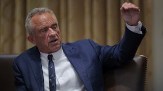 HHS Secretary RFK Jr sits in a meeting of Trump's Cabinet.