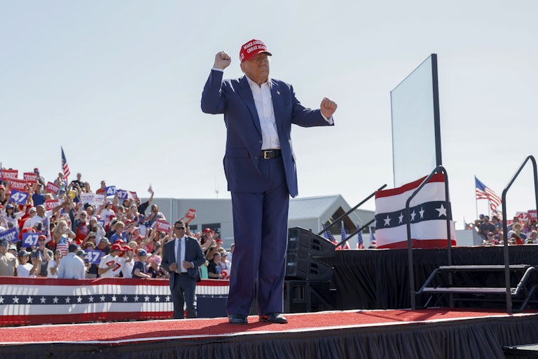 Donald Trump does his signature weird dance at a campaign rally outside