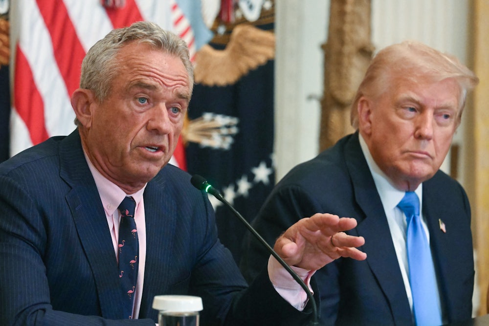 Health Secretary Robert F. Kennedy Jr. gestures and speaks during a Cabinet meeting while sitting next to Donald Trump