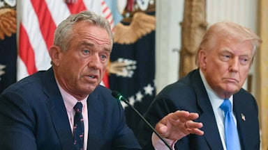 Health Secretary Robert F. Kennedy Jr. gestures and speaks during a Cabinet meeting while sitting next to Donald Trump