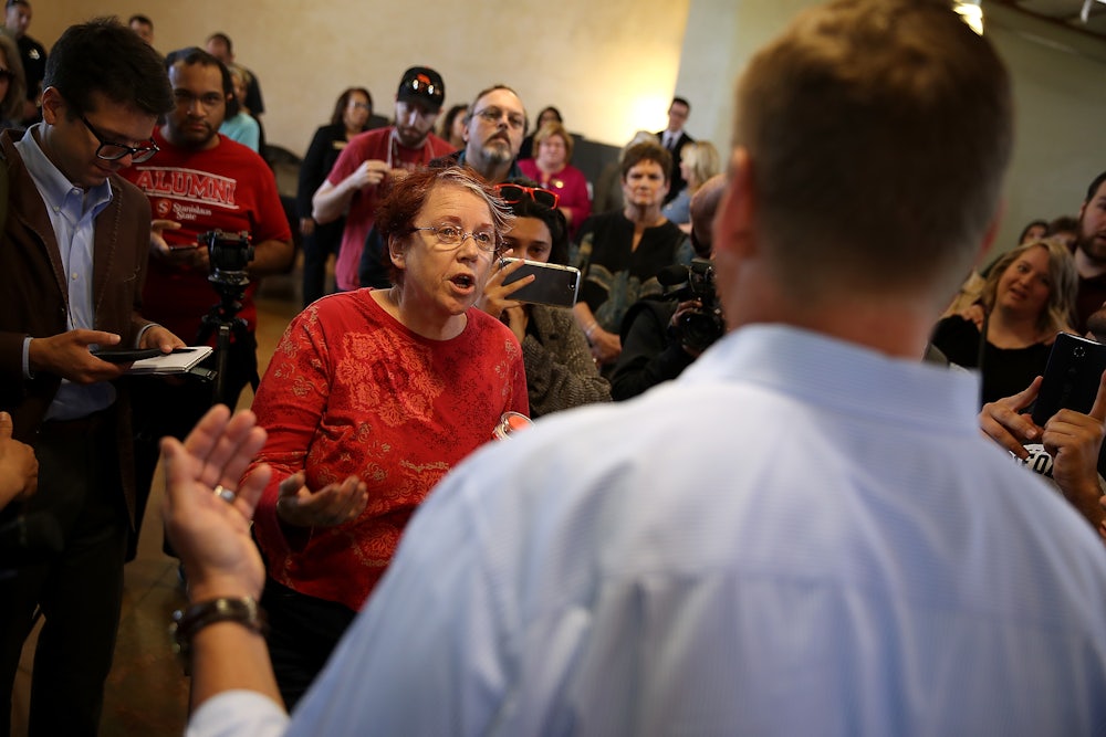 A constituent talks with then-Congressman Jeff Denham, a California Republican