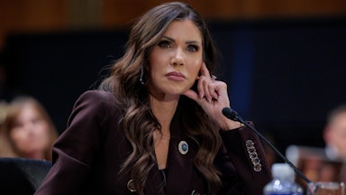 DHS Secretary Kristi Noem rests her head on her hand while testifying to Congress.