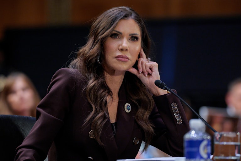 DHS Secretary Kristi Noem rests her head on her hand while testifying to Congress.