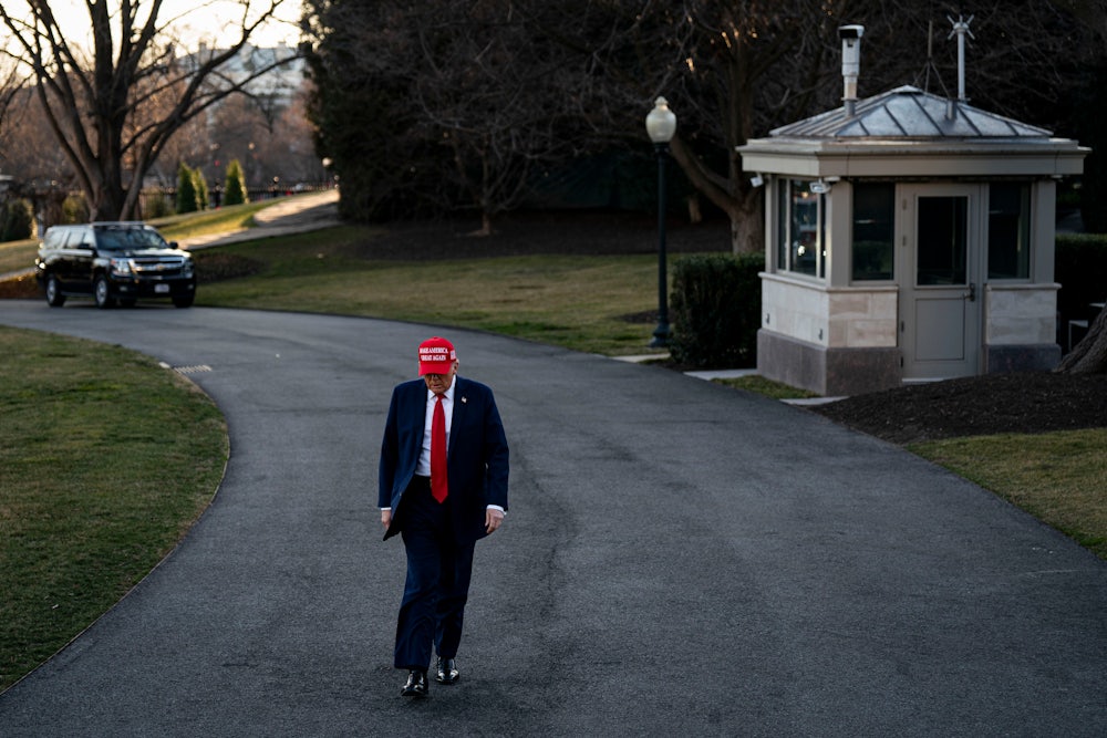 Donald Trump walks to speak to members of the media on the South Lawn of the White House.