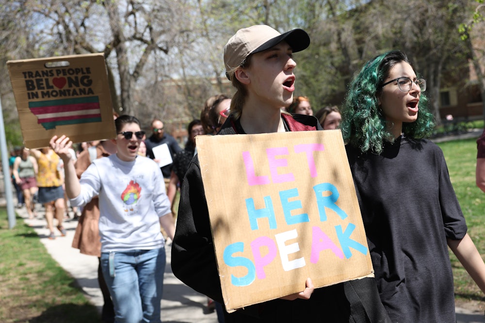 Transgender rights activists march through the University of Montana campus in Missoula