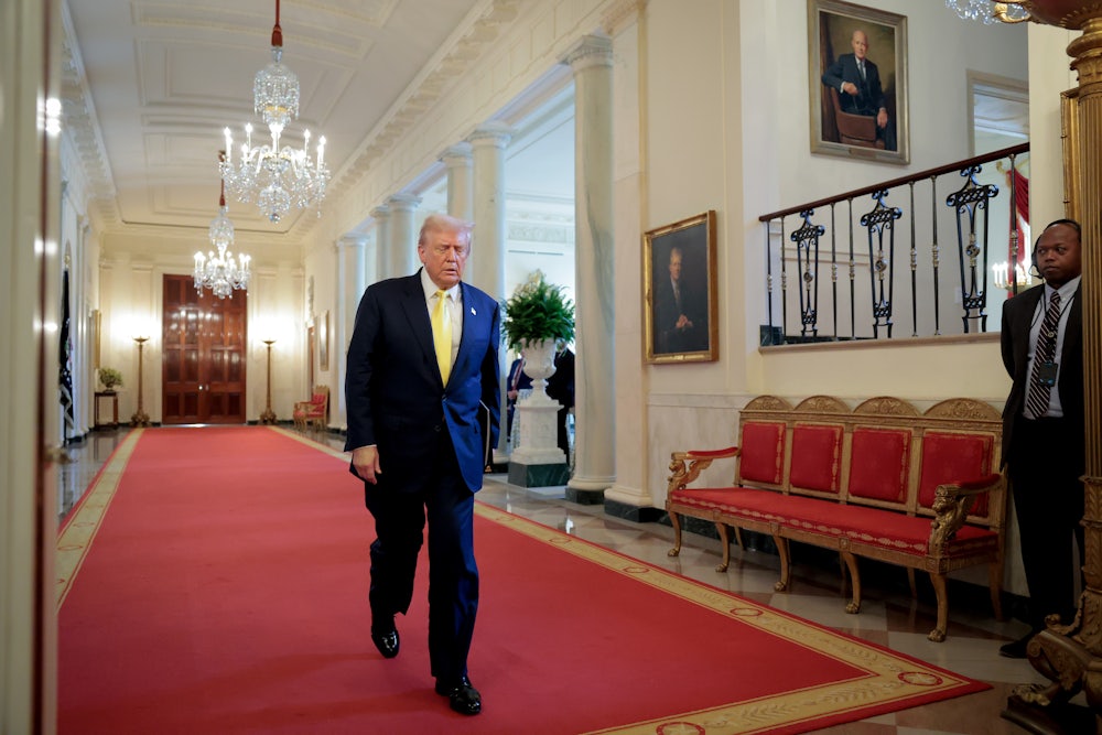 Donald Trump arrives for an event to honor recipients of the Purple Heart in the East Room of the White House.