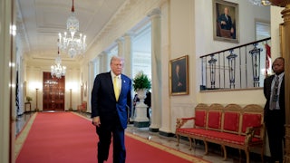 Donald Trump arrives for an event to honor recipients of the Purple Heart in the East Room of the White House.