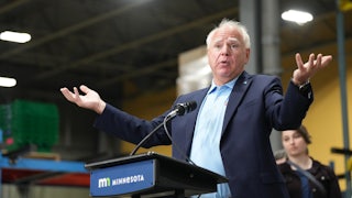 Minnesota Governor Tim Walz spreads his arms