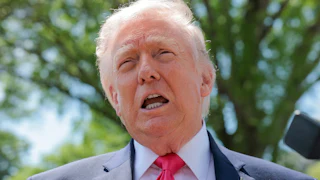 Donald Trump speaks to reporters outside the White House