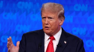 Donald Trump speaks and makes a hand gesture