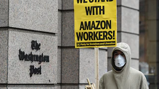 Activists and Amazon workers protest Jeff Bezos outside the Washington Post Headquarters in Washington, D.C.