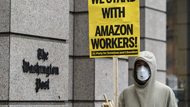 Activists and Amazon workers protest Jeff Bezos outside the Washington Post Headquarters in Washington, D.C.