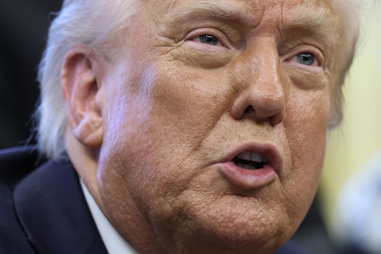 Donald Trump speaks to reporters in the Oval Office