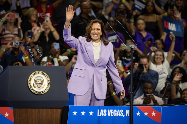 Kamala Harris waves at a campaign event