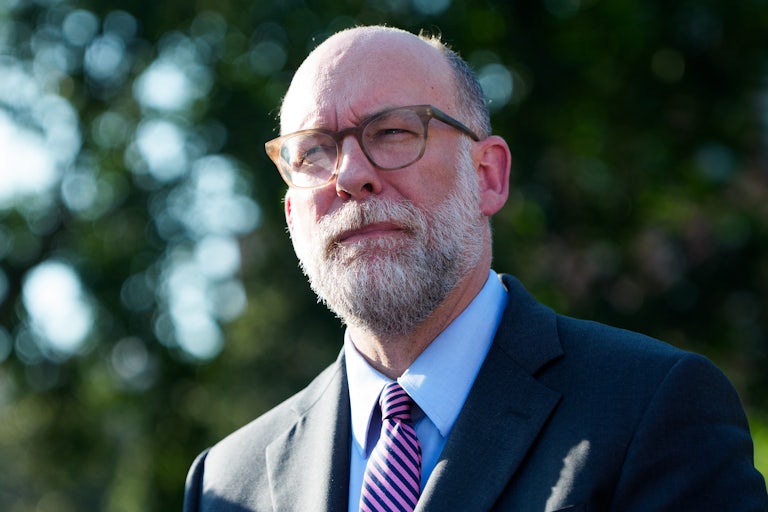 OMB Director Russell Vought squints while standing outside the White House