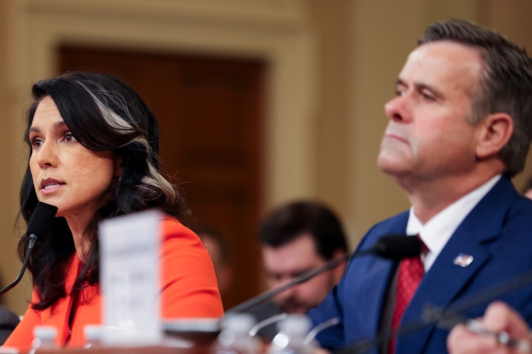 Tulsi Gabbard speaks while sitting next to CIA Director John Ratcliffe in a House Intelligence Committee meeting