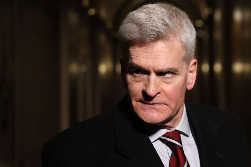 Louisiana Senator Bill Cassidy glowers in a dark hallway.