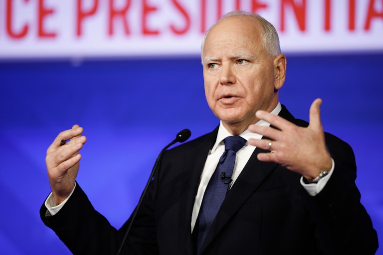 Tim Walz gestures while speaking during the vice presidential debate