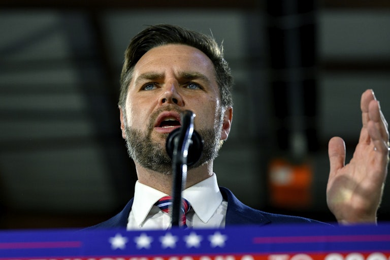 J.D. Vance gestures while speaking at a Donald Trump rally