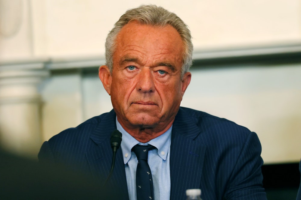 RFK Jr. looks into the camera at a press conference.