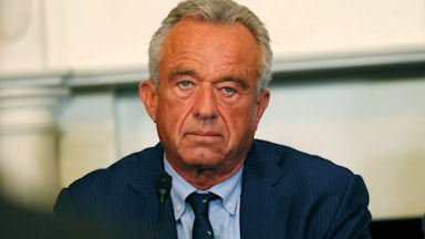 RFK Jr. looks into the camera at a press conference.