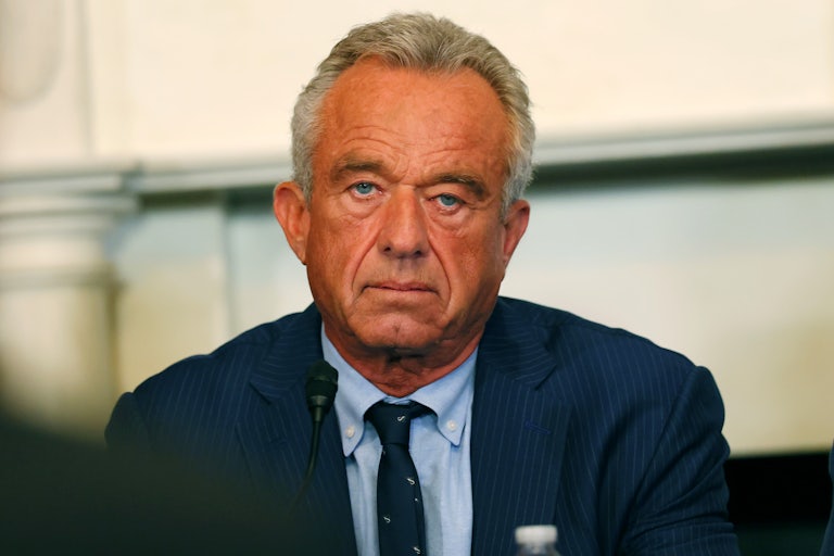RFK Jr. looks into the camera at a press conference.